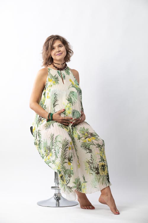 Pregnant woman posing in a photo studio photographed by a professional maternity photographer in Copenhagen